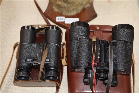 A fox head wall trophy and two pairs of field glasses